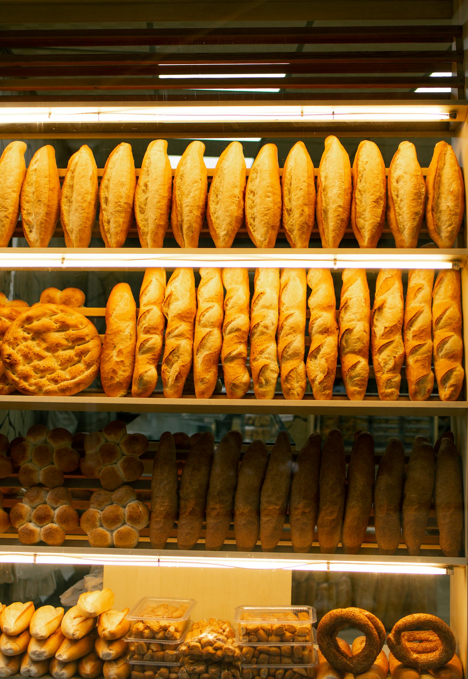 Glass display cabinet showing a variety of pastries and cakes