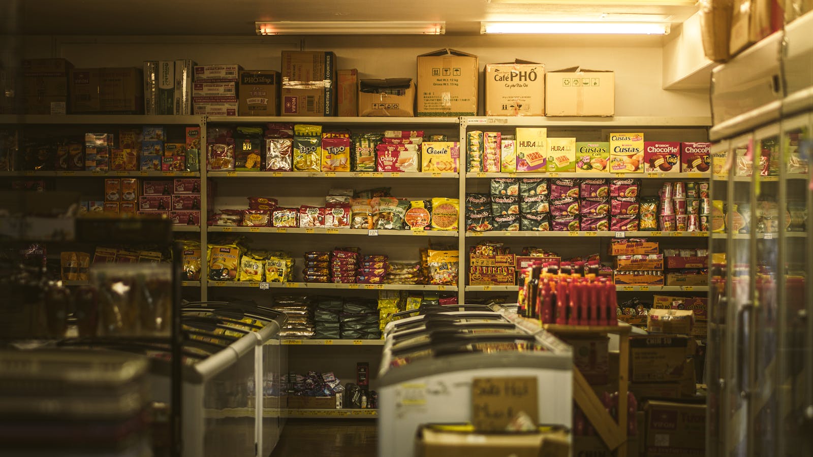 Colourful drink aisle with promotional signage