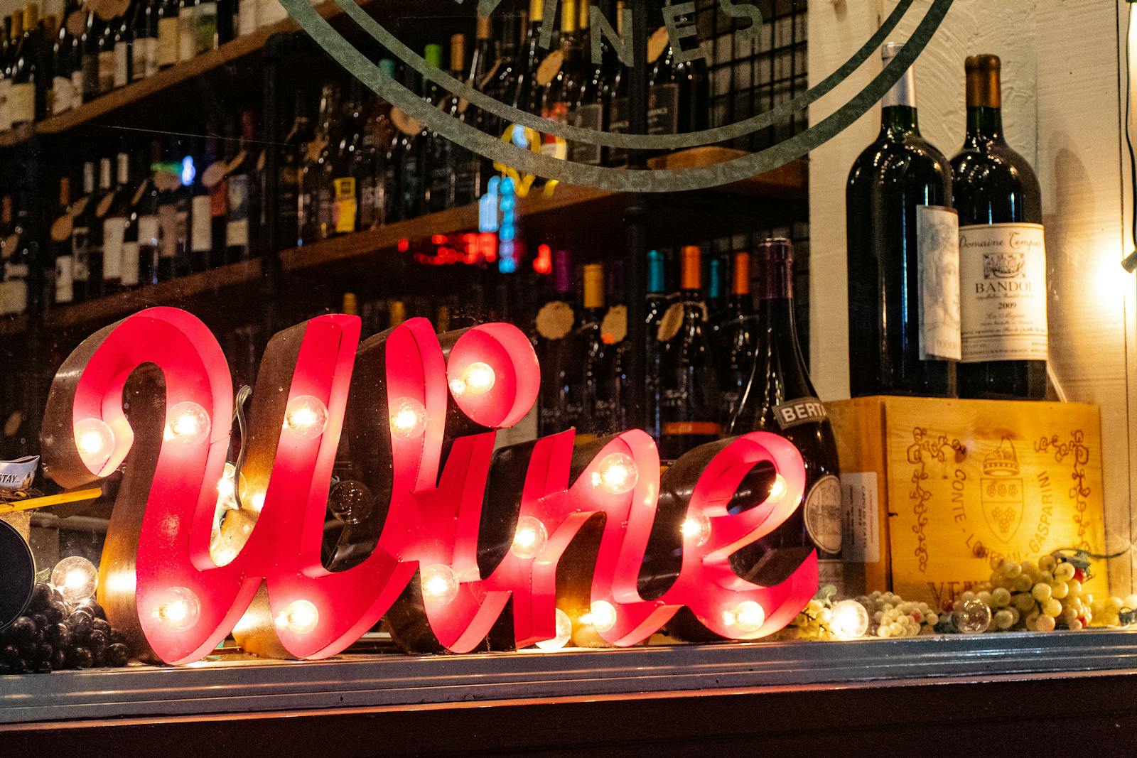 Two friends choosing a bottle of wine in a shop