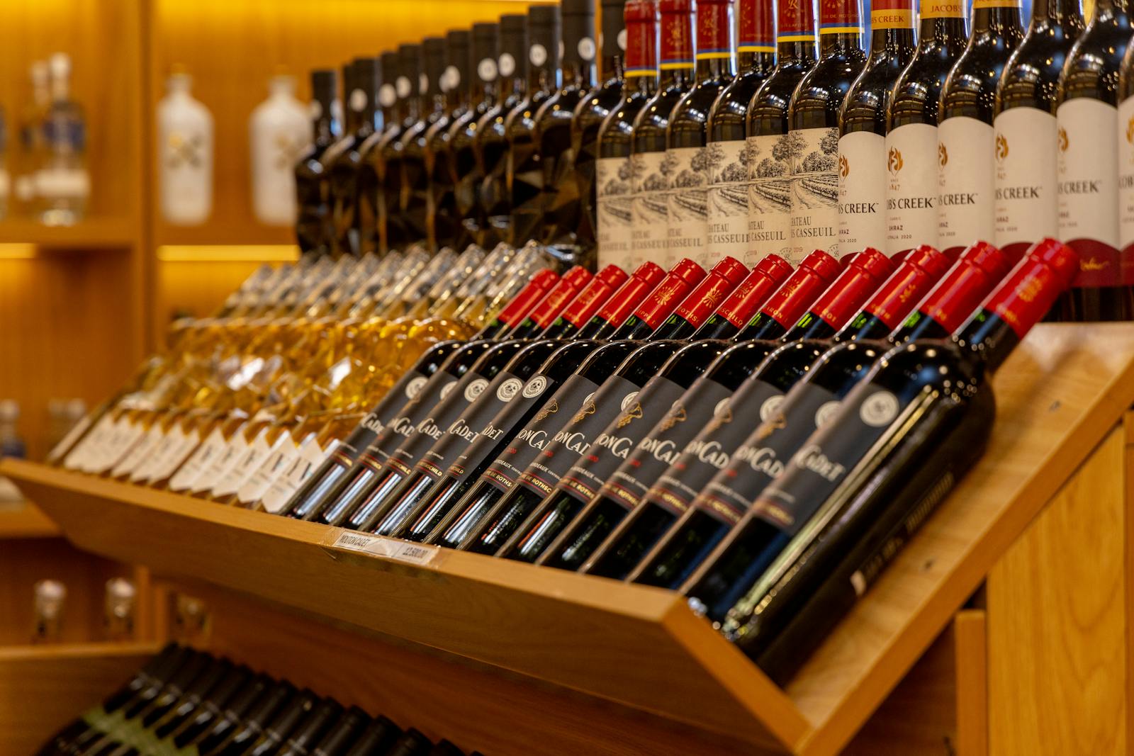 Charming wine shop window display with bottles inviting customers in