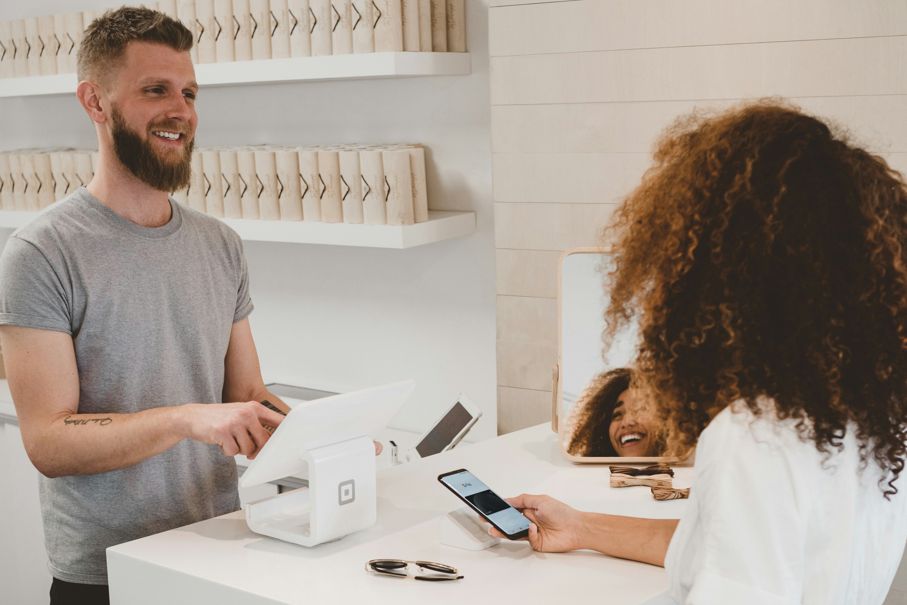 Customer holding a loyalty card at the counter