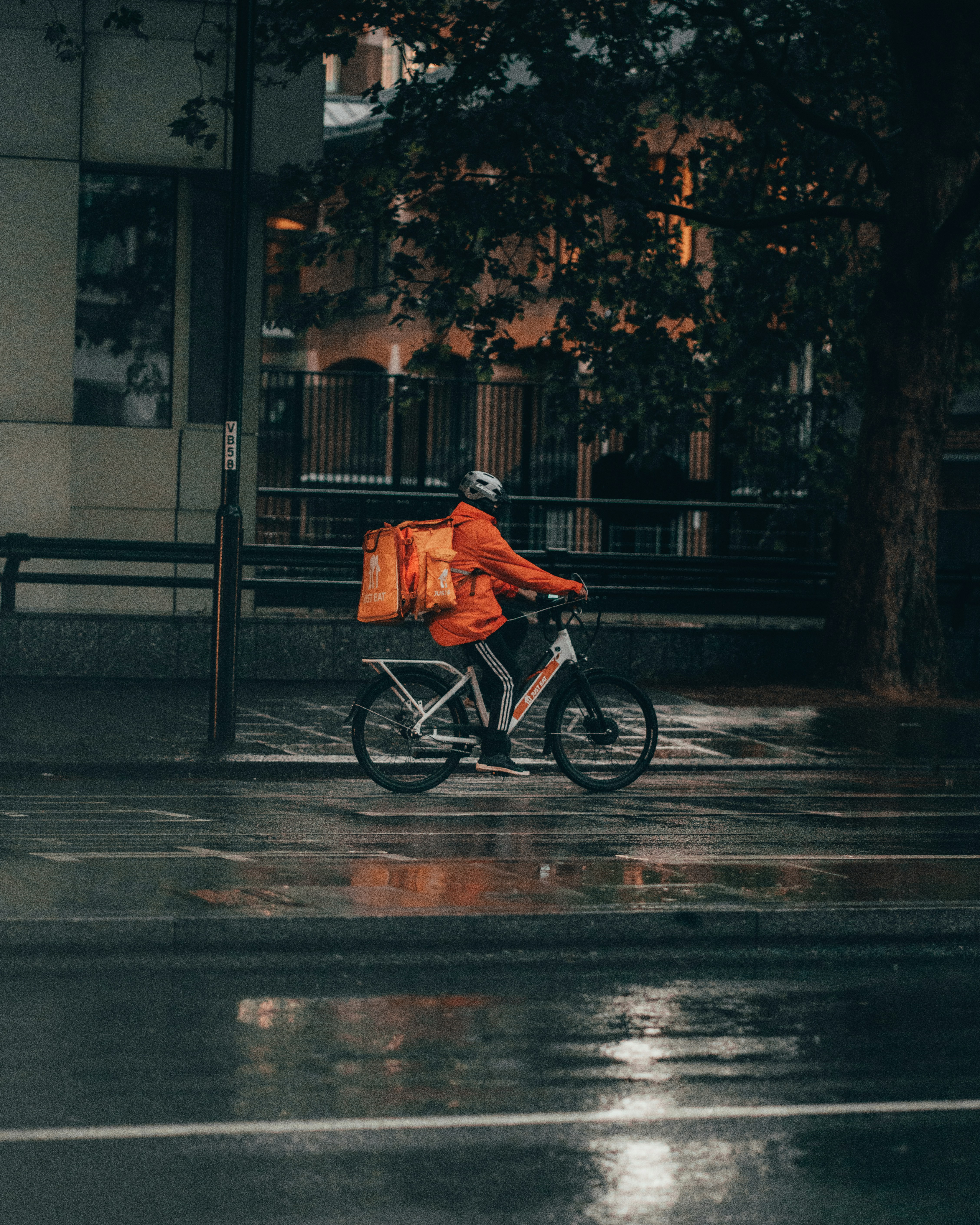 Delivery driver handing over a package at a customer's door