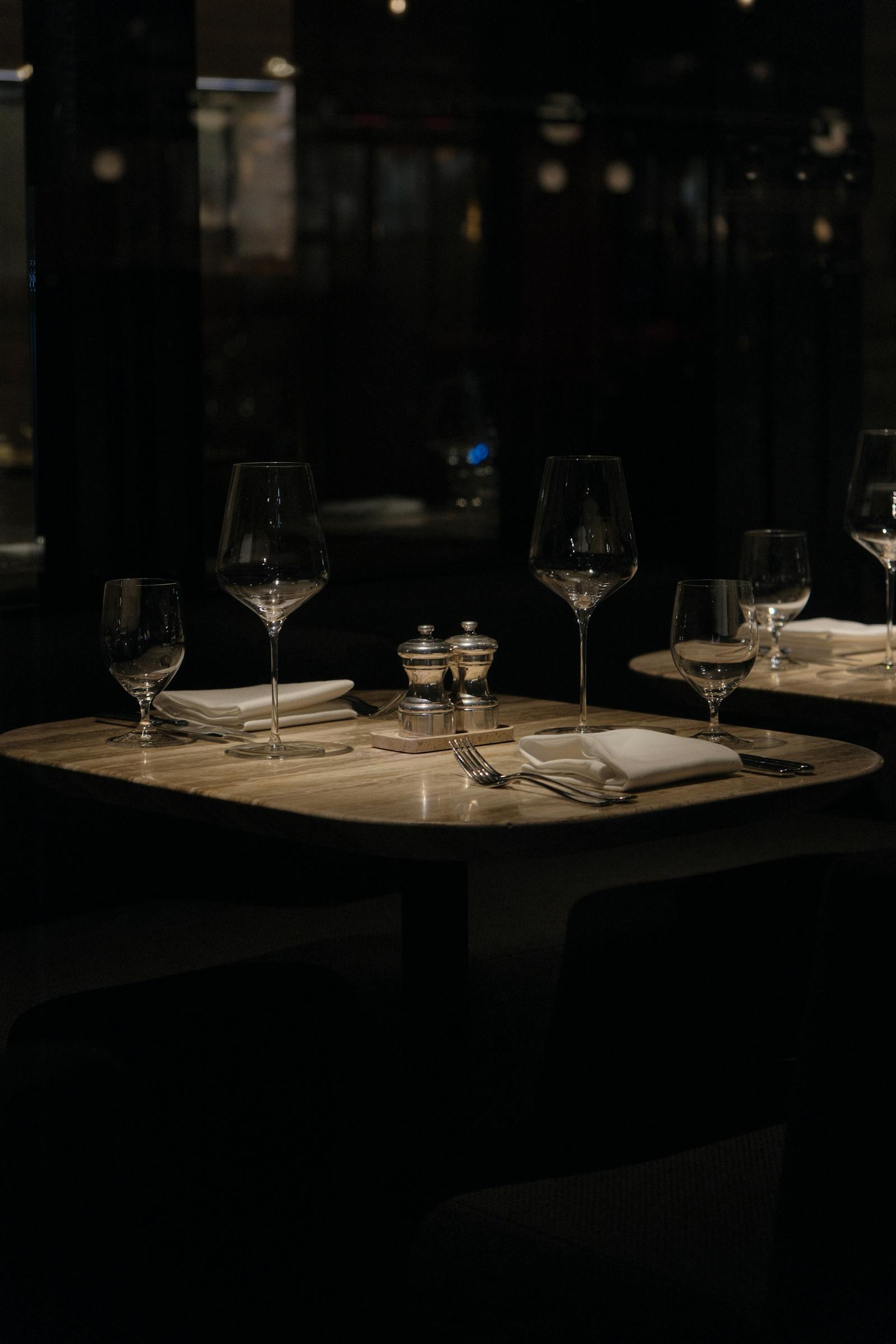 Restaurant table set with wine glasses, ready for service